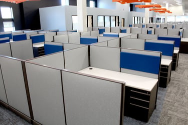 Several cubicle workspaces in Grand River Aseptic Manufacturing.